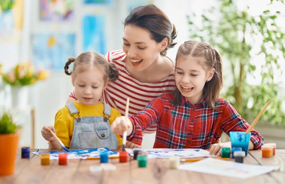 Children and ski nanny painting indoor