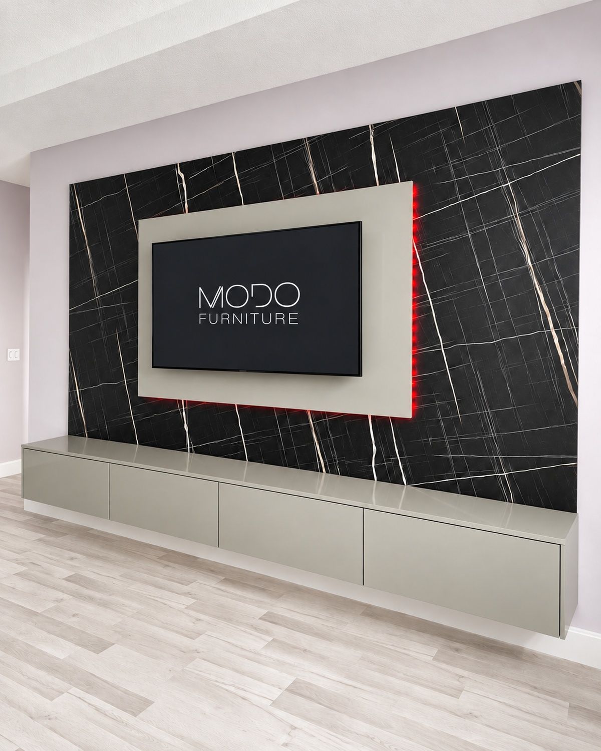 Black marble-look TV wall with a white frame and red LED glow above a long floating gray console