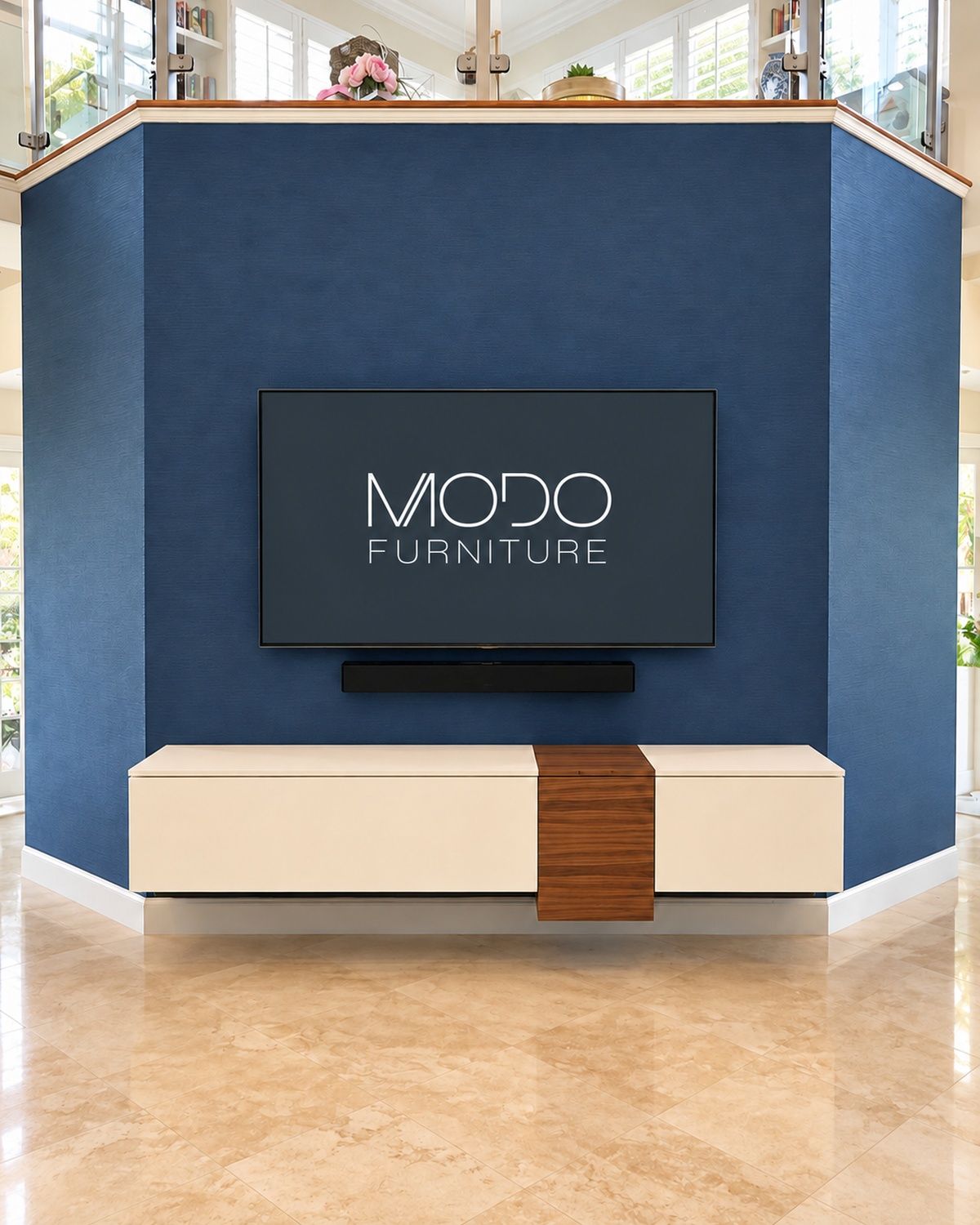 Blue textured accent TV wall with a cream floating console and a walnut inlay strip