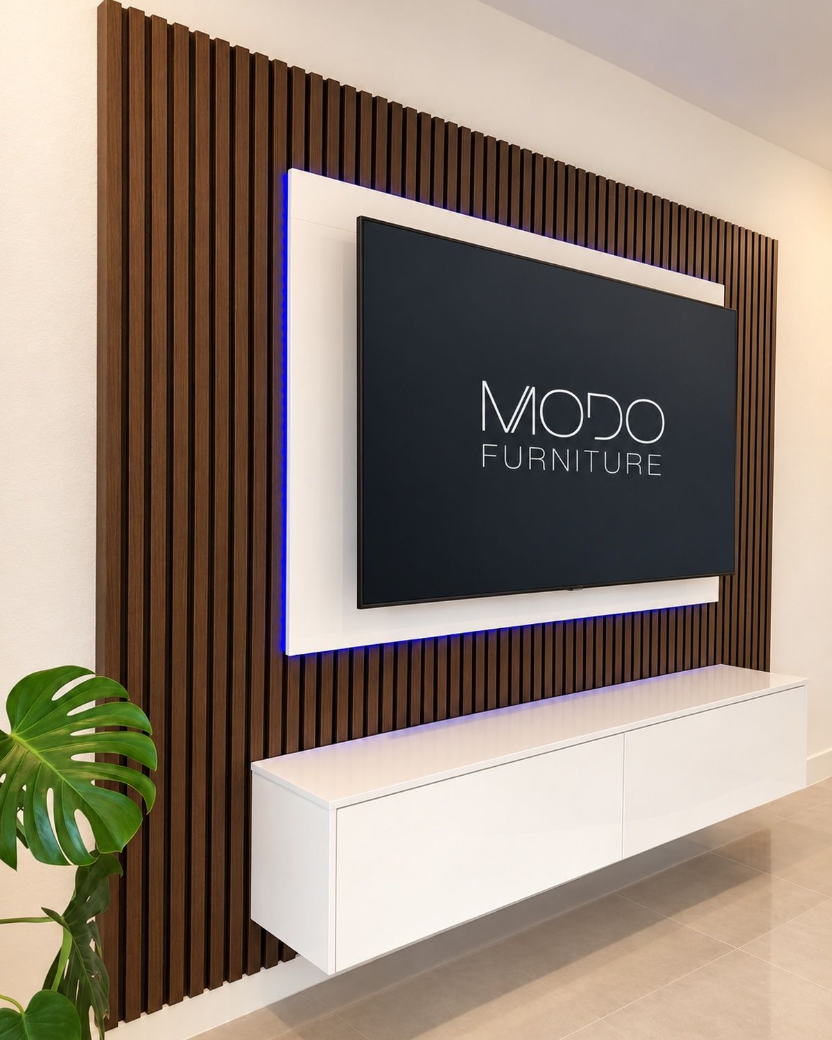 Walnut slat TV wall with a white frame and blue LED backlight above a floating white gloss console