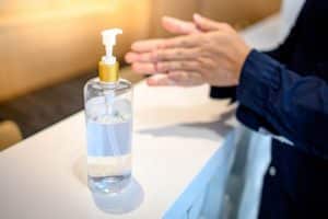 A man using hand sanitizer