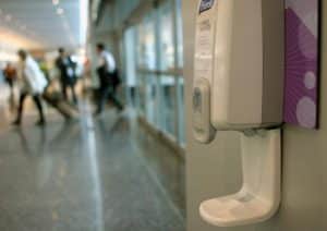 Hand sanitiser in the hallway near a clinic doing antigen testing kit and full allergy profile