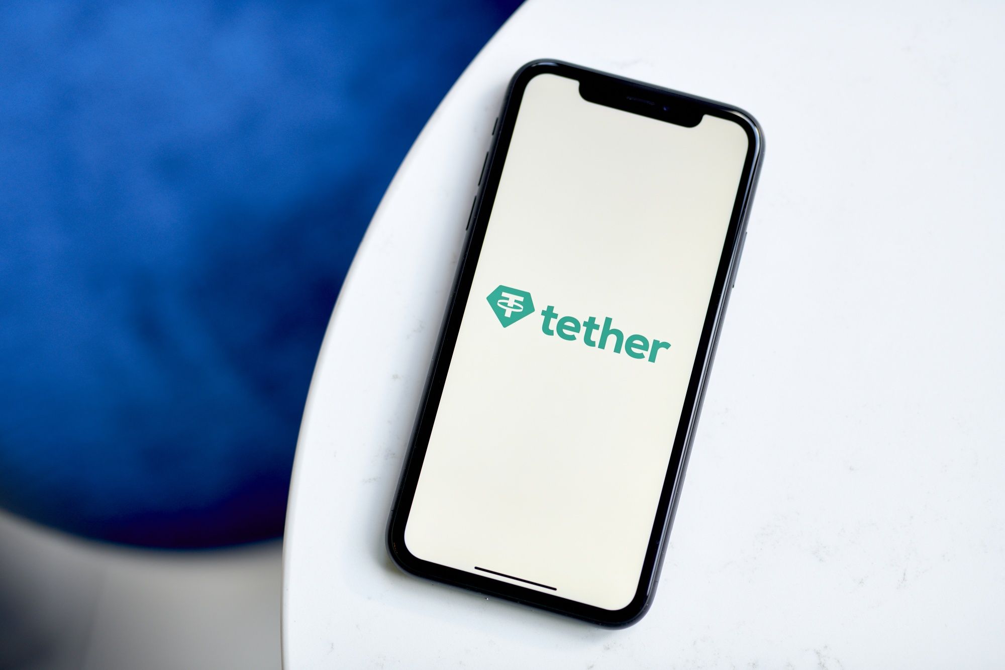 Tether logo on a smartphone