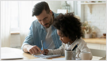A male tutor explaining a topic to a young student for an in-person lesson. A male tutor explaining a topic to a young student for an in-person lesson.