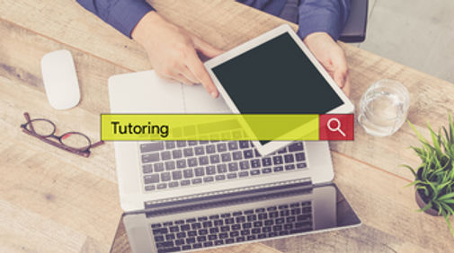 A searchbar with the word 'Tutoring' with a laptop in the background.