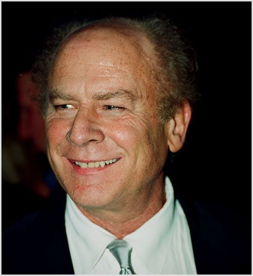 Art Garfunkel - teacher-turned-musician Head-and-shoulders photo of Art Garfunkel in a suit, smiling; he taught before focusing on music.