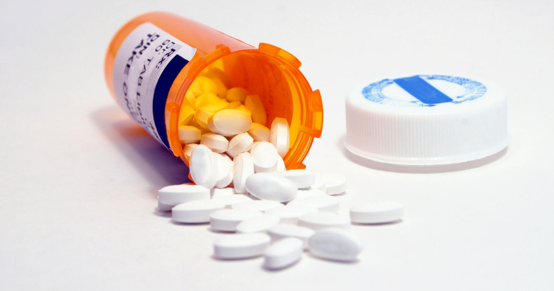 Medicine Bottle and White Pills