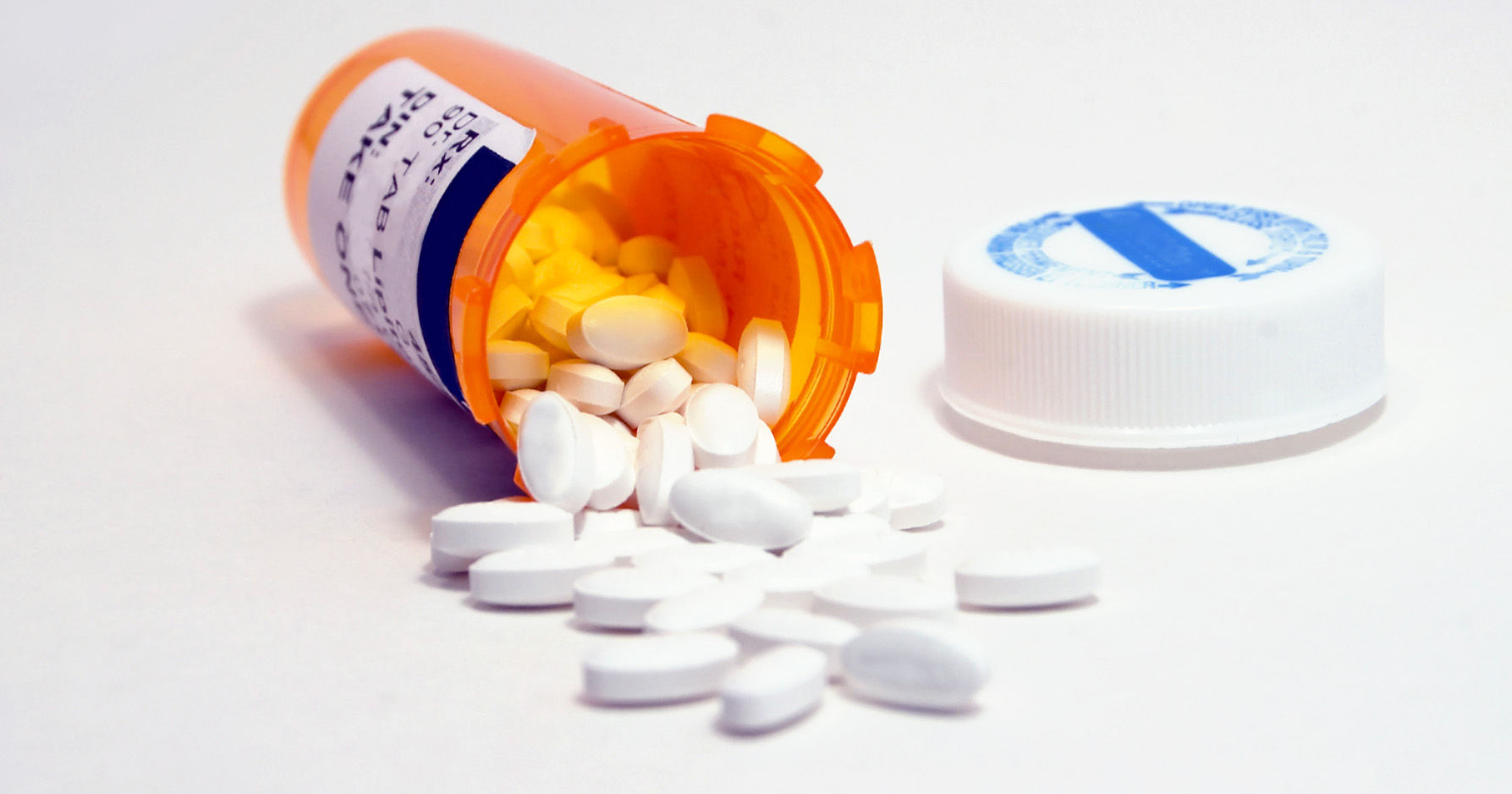 Medicine Bottle and White Pills