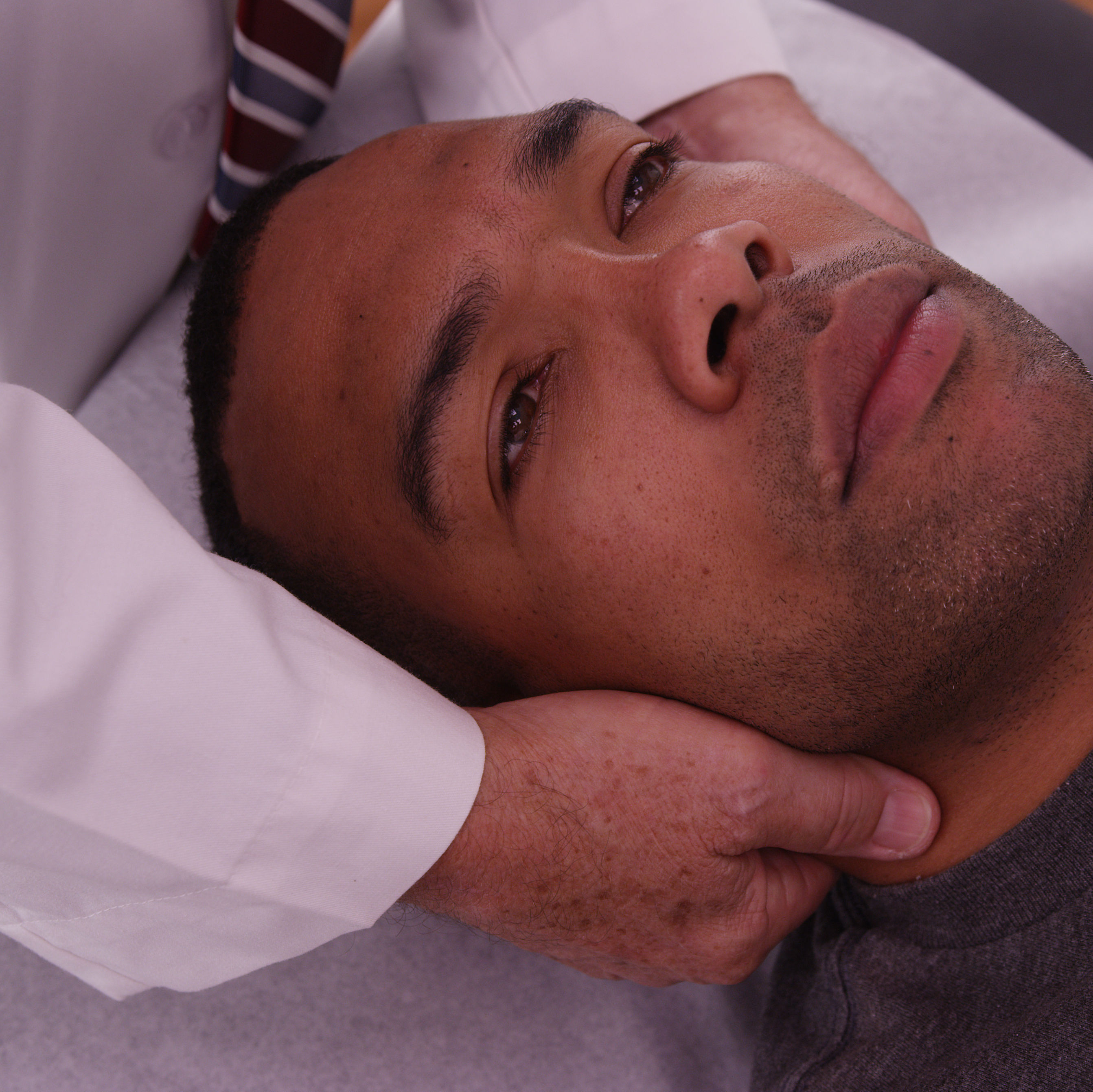 up close African American chiropractic adjustment