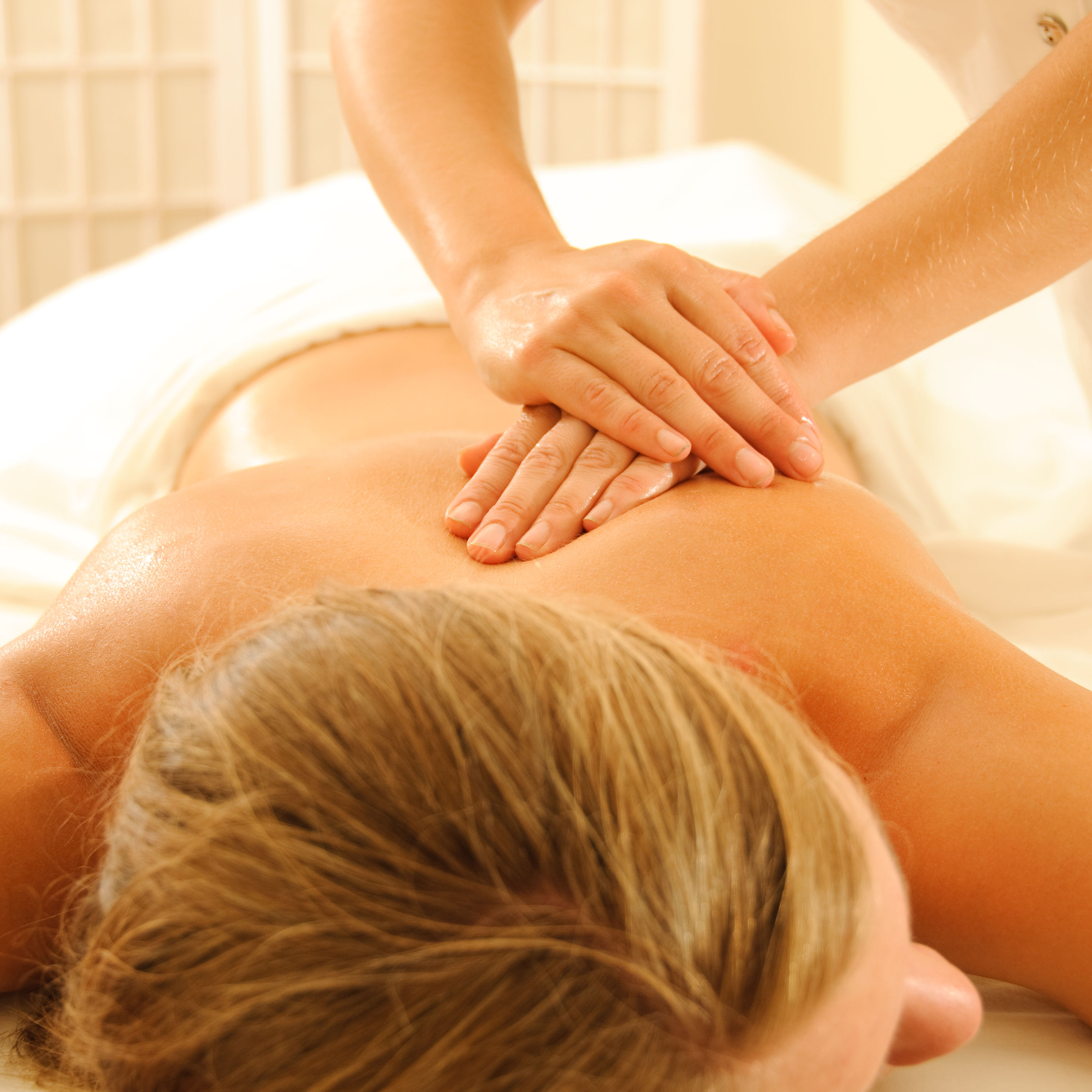 up close white female massage therapy female massage therapist