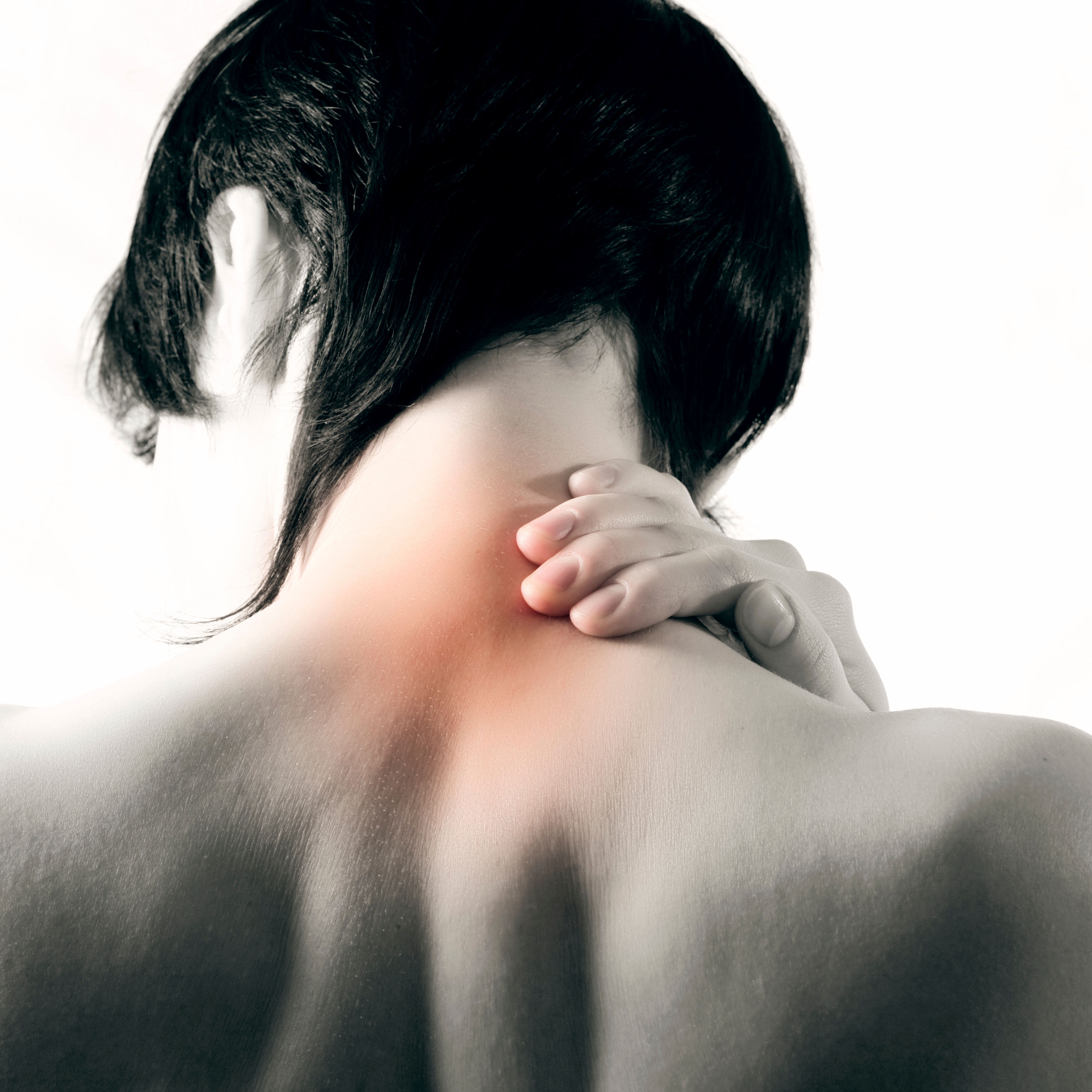 person holds neck that is highlighted to illustrate pain