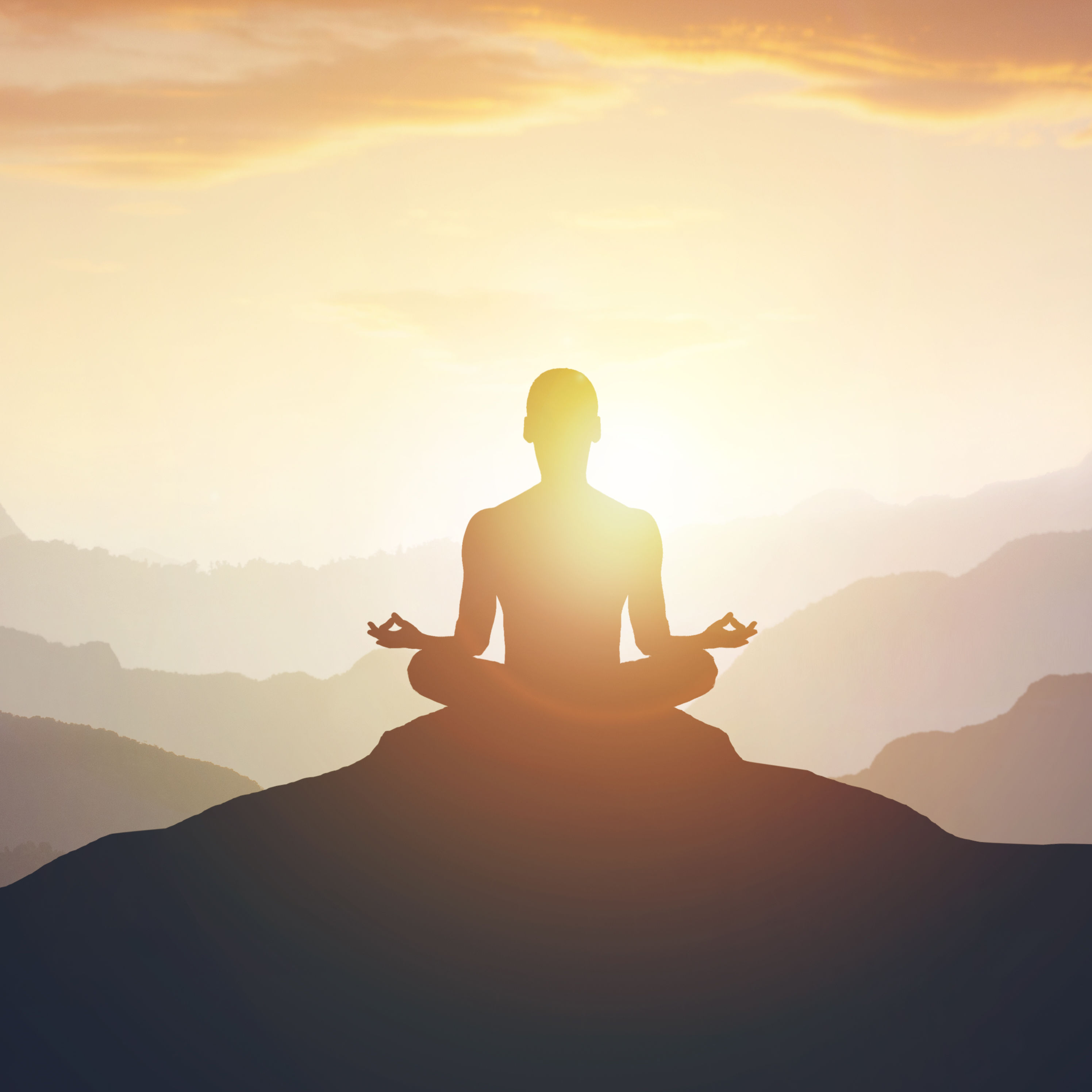 Silhouette of the meditaion man on the mountain