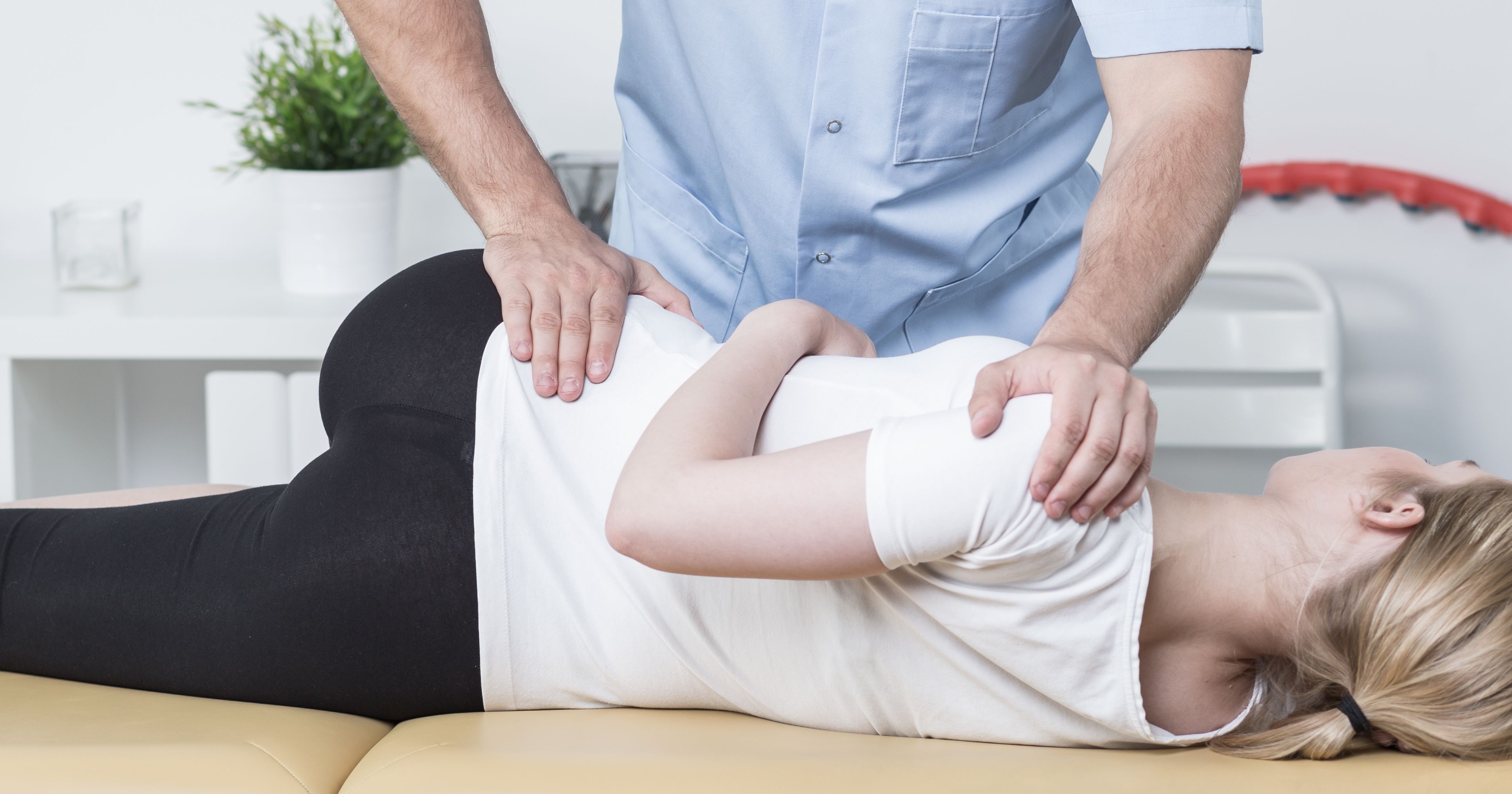 Chiropractic examining patient