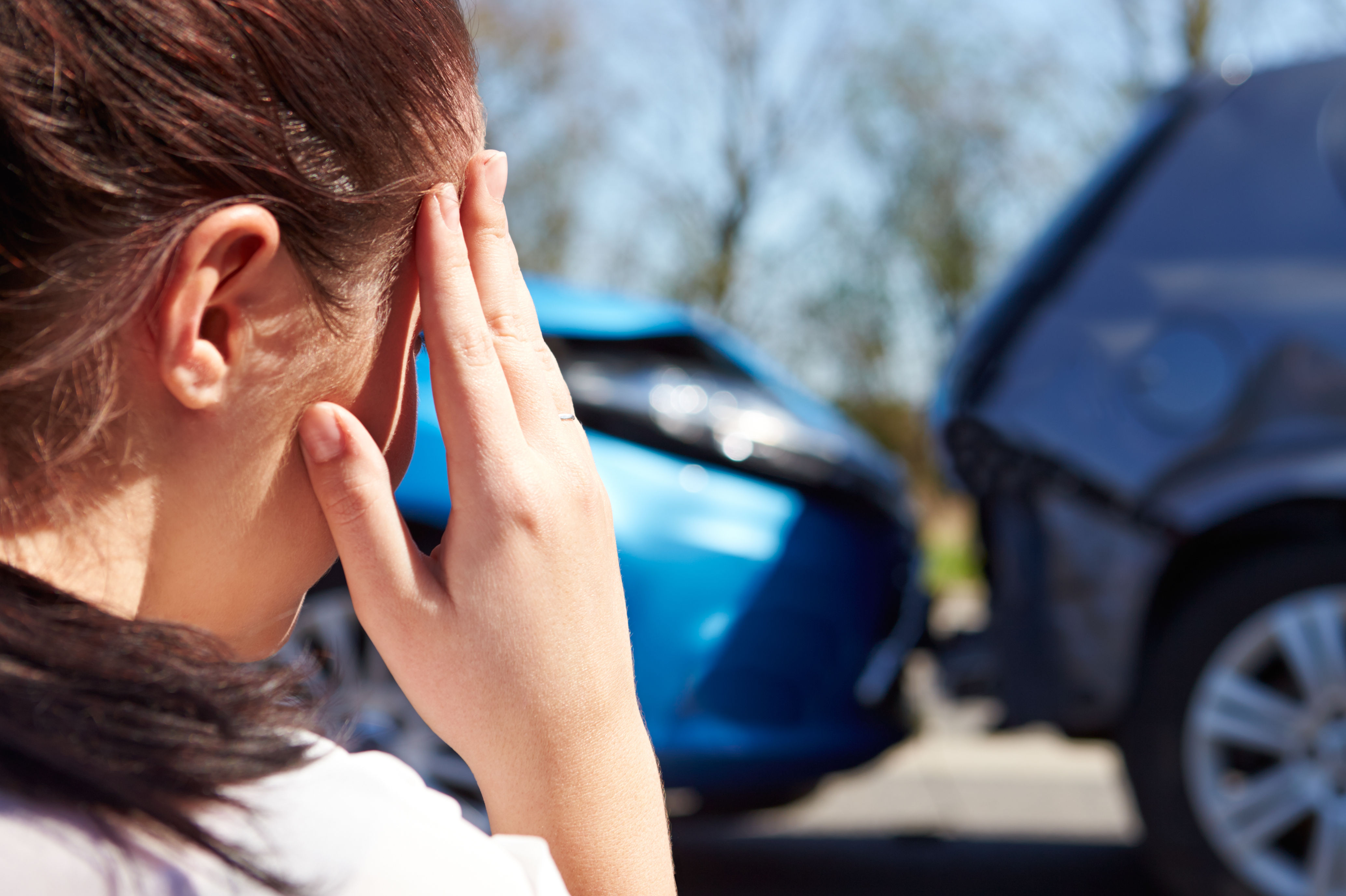 Concerned driver with defocused traffic accident