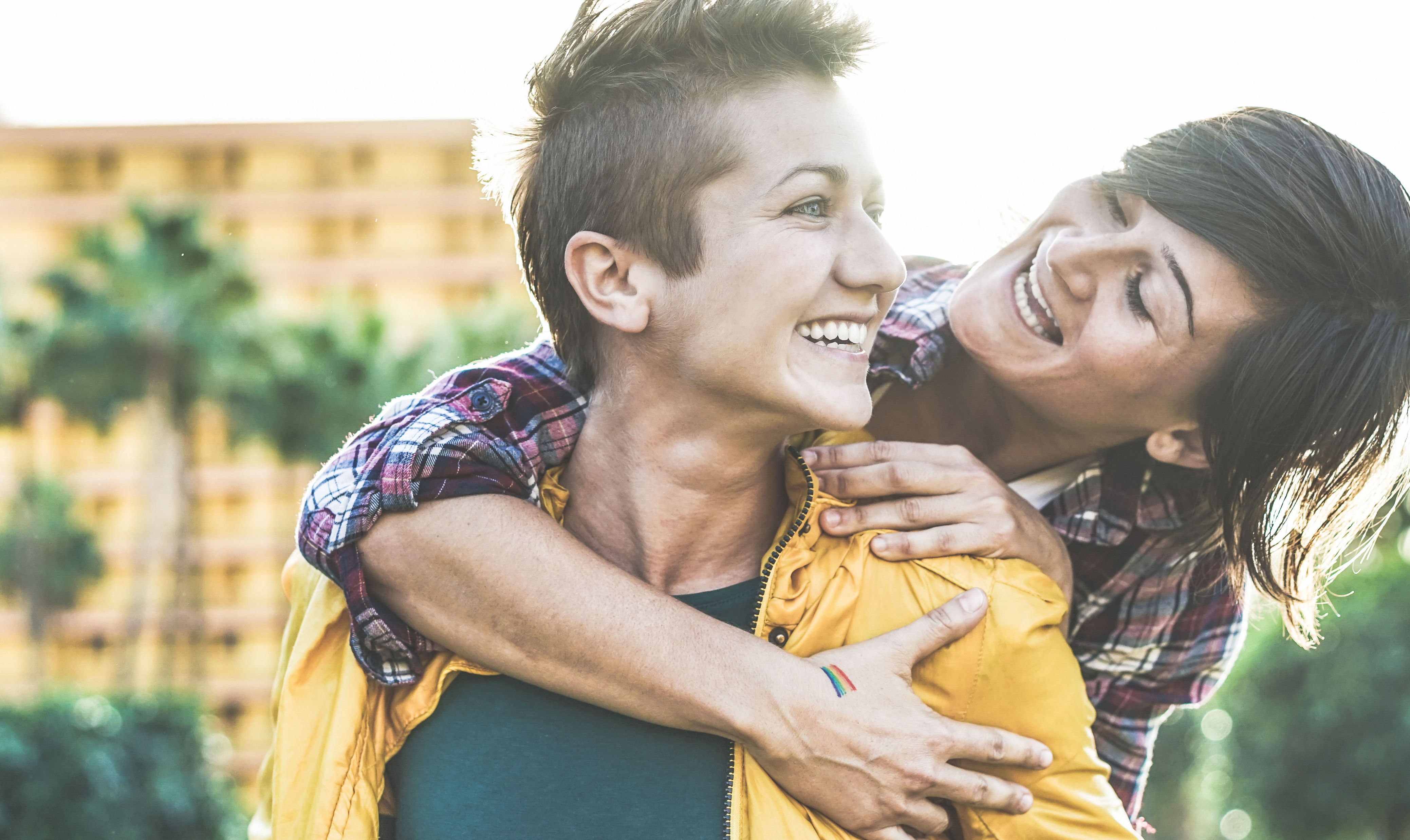 Happy gay couple having fun together outdoor - You