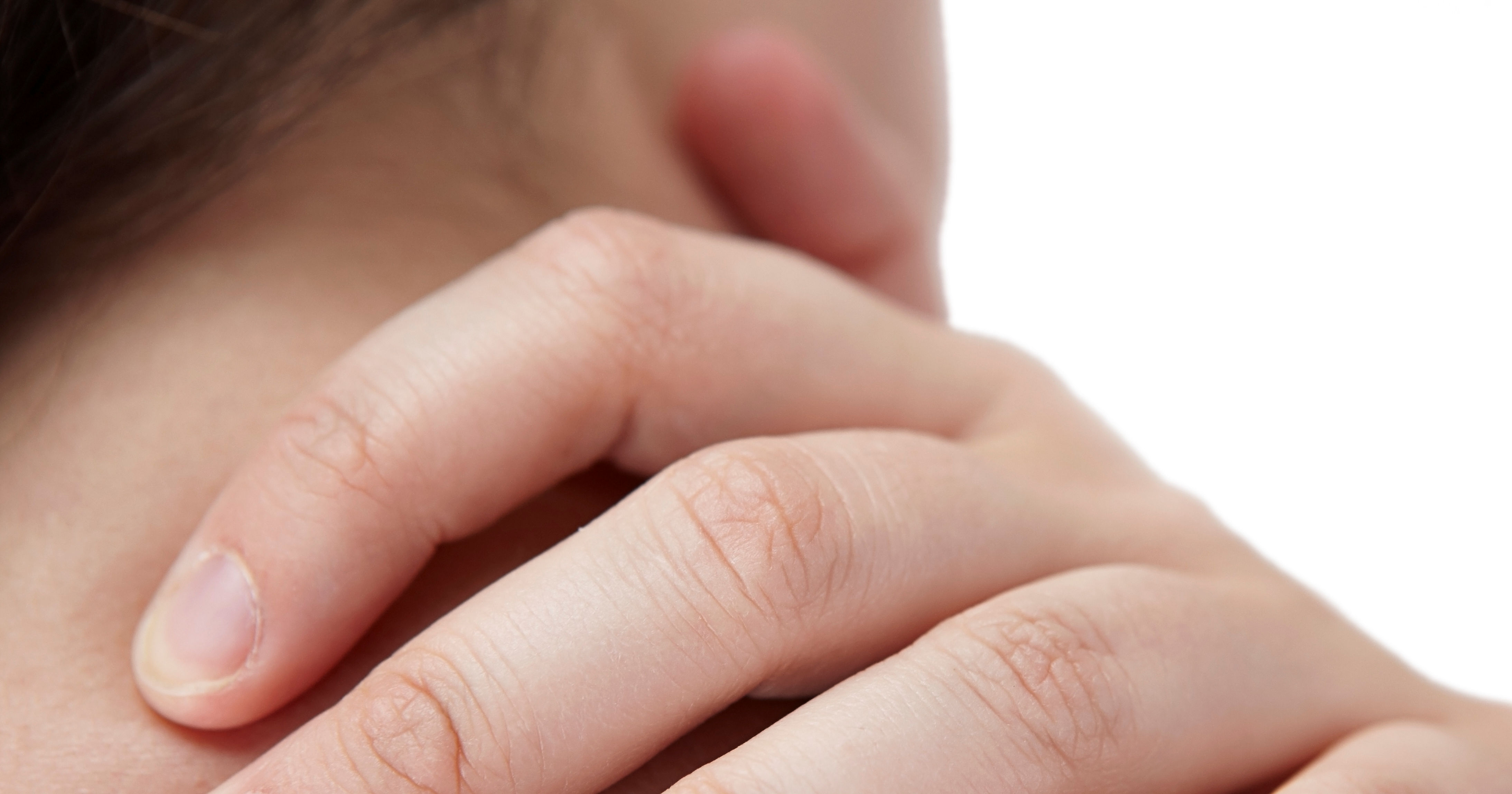 extreme closeup of fingers on person's shoulder