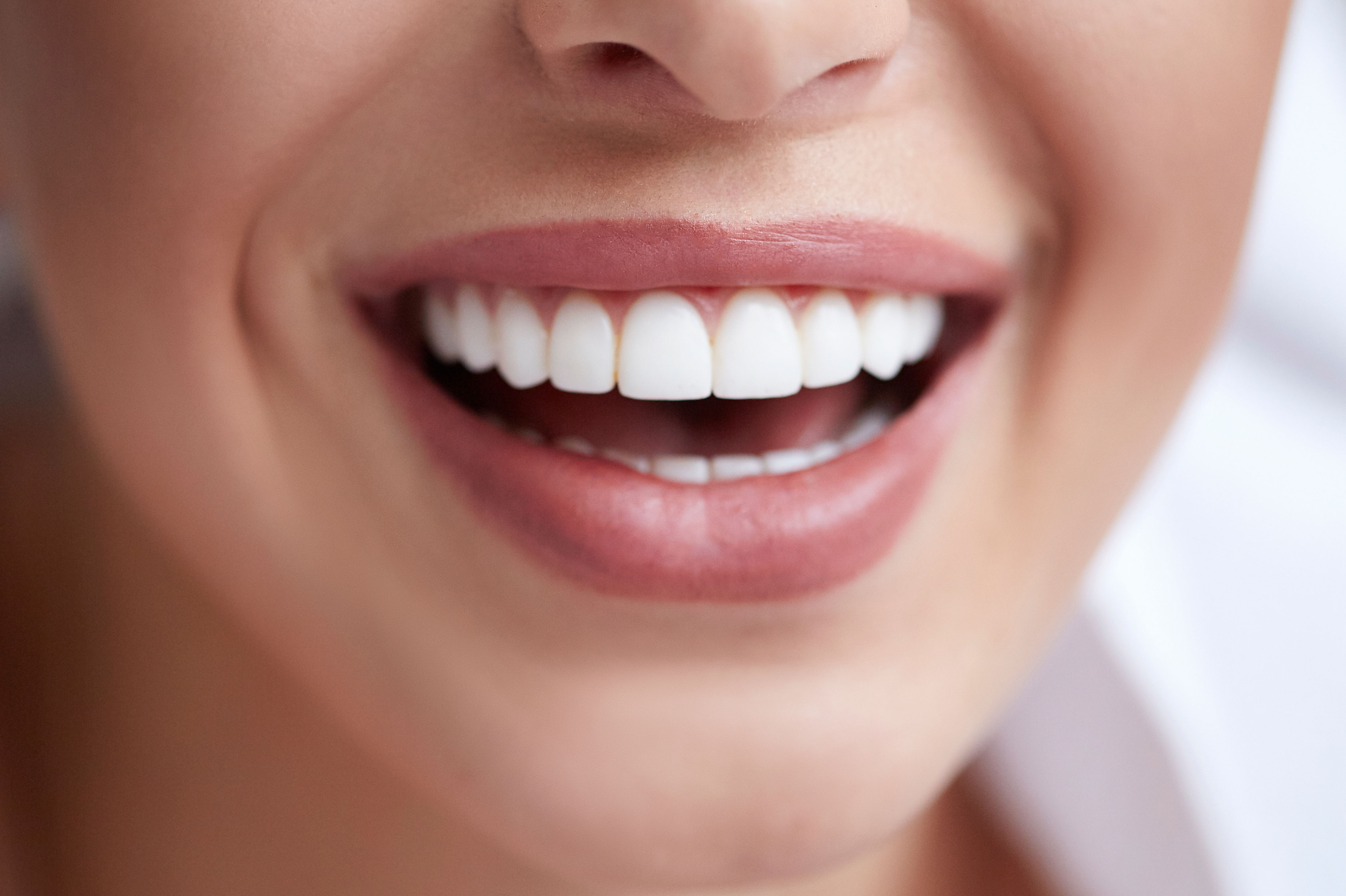 Healthy white smile close up. Beauty woman with pe