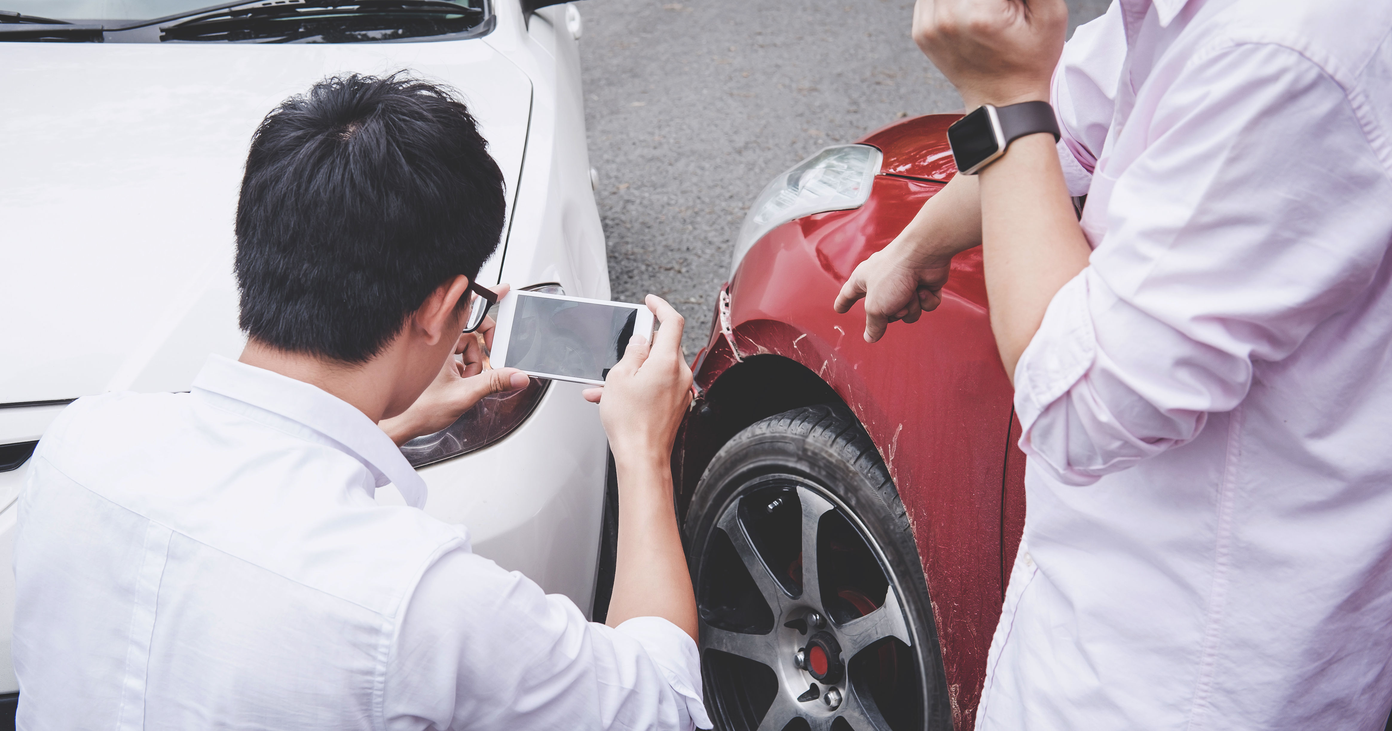 Two drivers man arguing after a car traffic accide