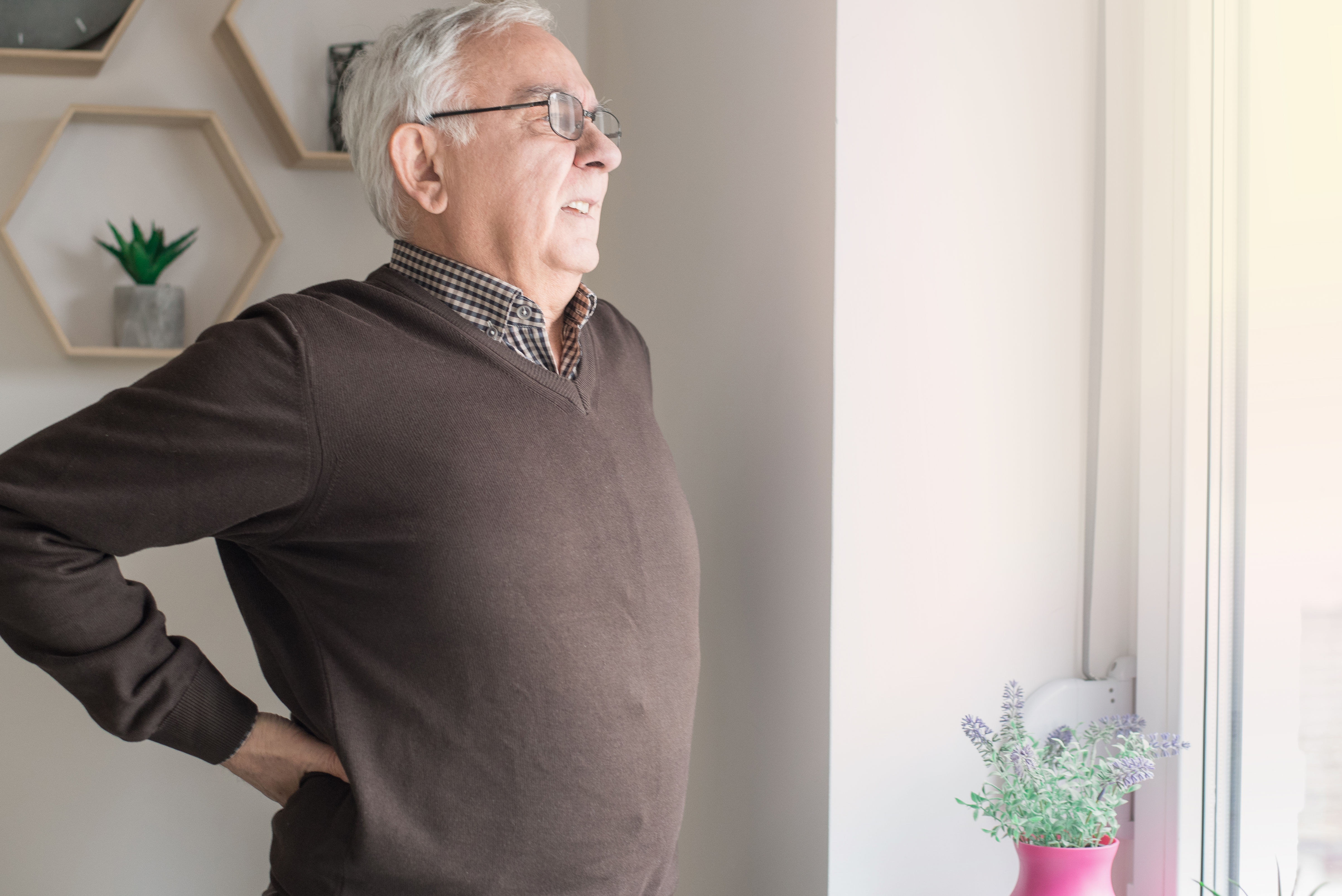 Elderly man having back pain issues