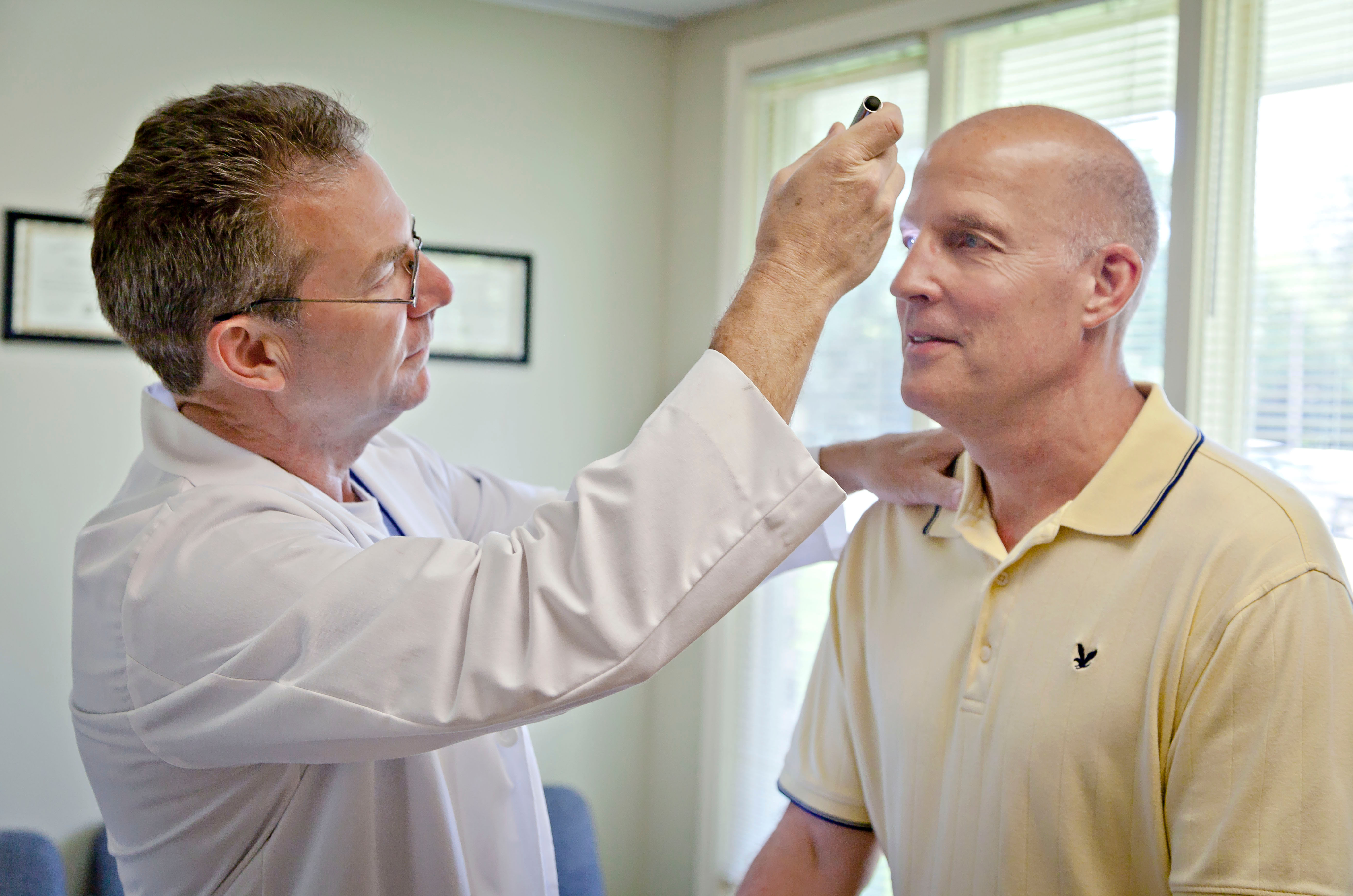 doctor examines patient