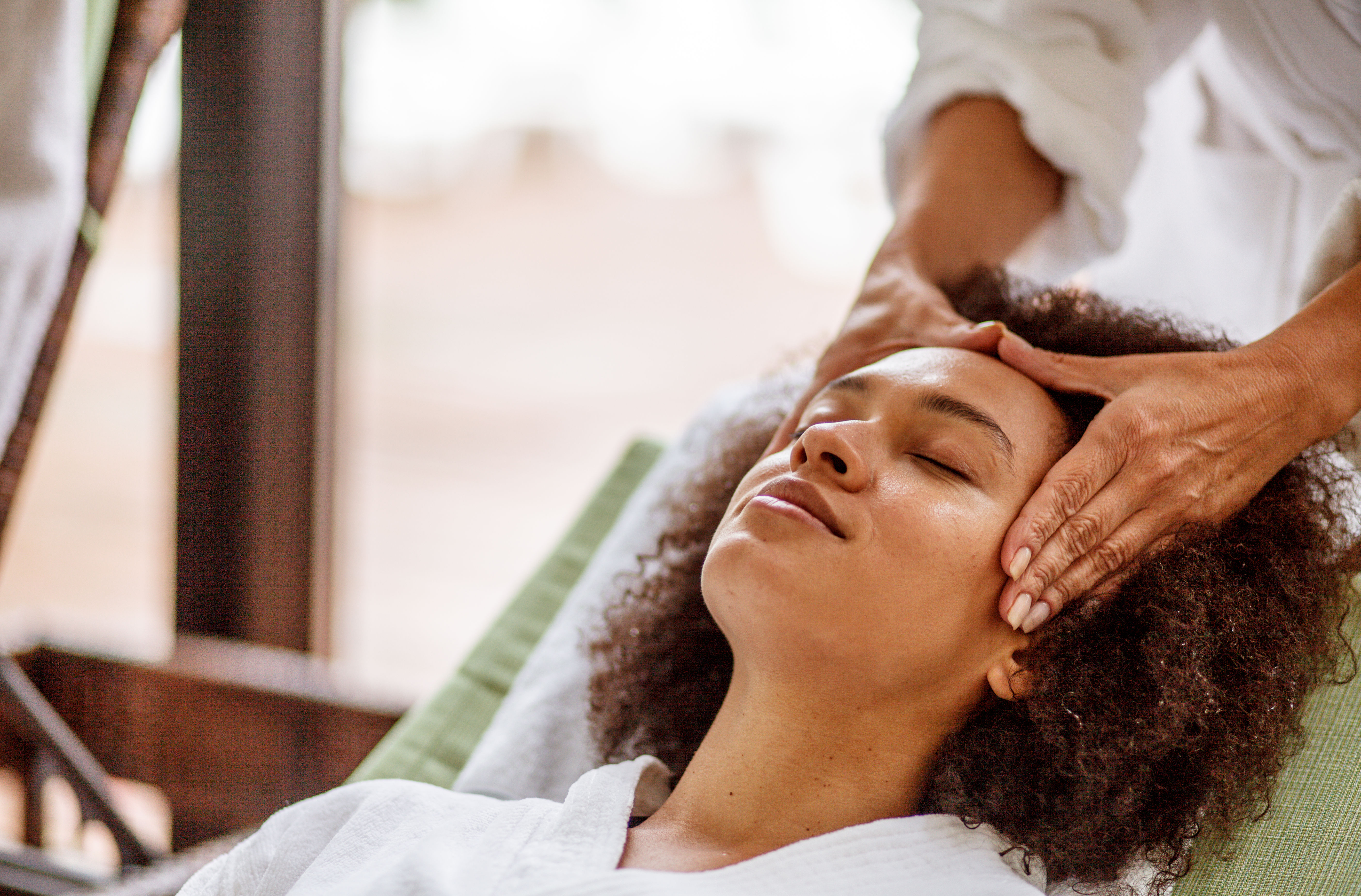 Woman relaxing during head massage