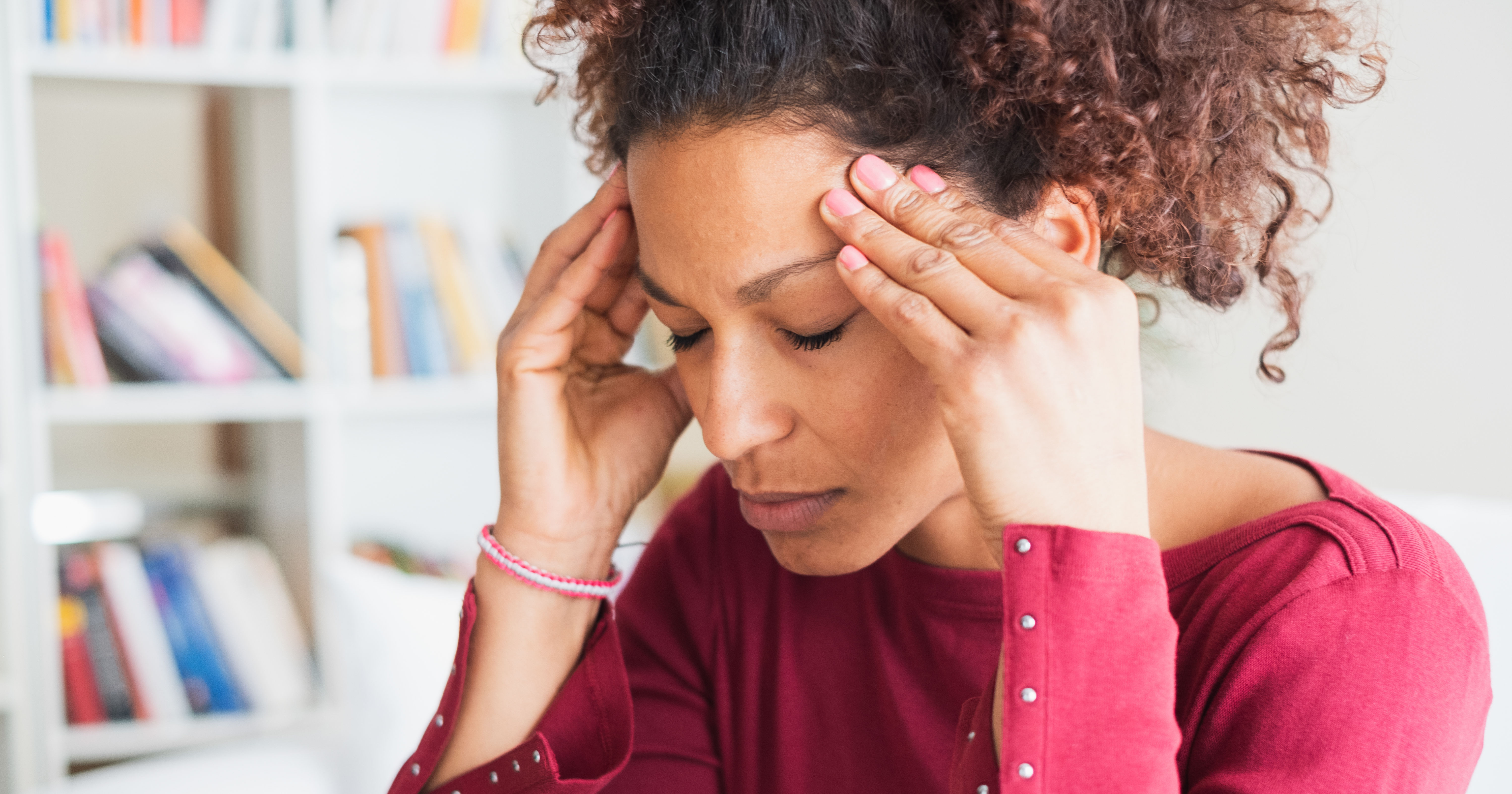 Young black woman suffering strong headache