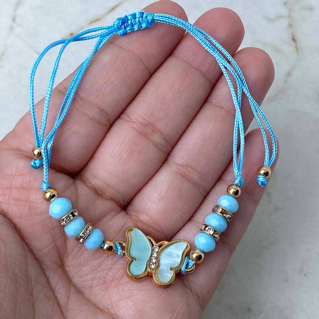 TOBILLERA/PULSERA DE HILO REGULABLE - MARIPOSA CELESTE