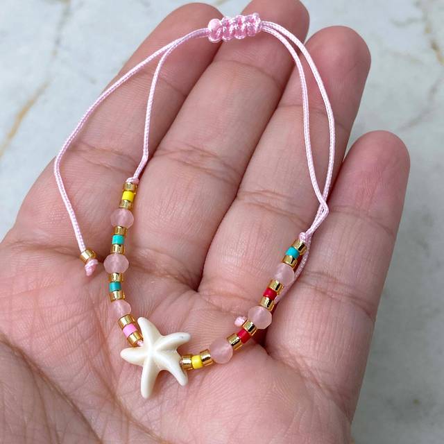 TOBILLERA/PULSERA DE HILO REGULABLE - ESTRELLA DE MAR ROSA