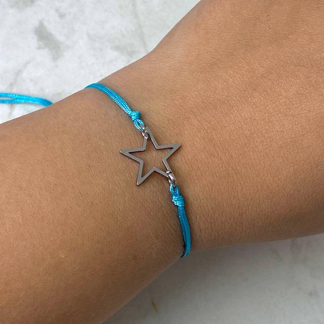 PULSERA DE HILO REGULABLE CON DIJE ESTRELLA - CELESTE
