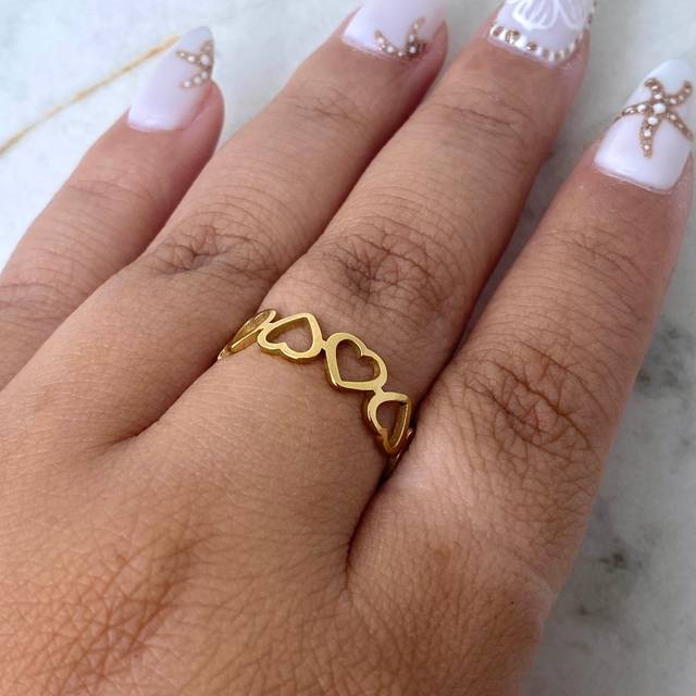 ANILLO ACERO DORADO CORAZONES CONTINUOS