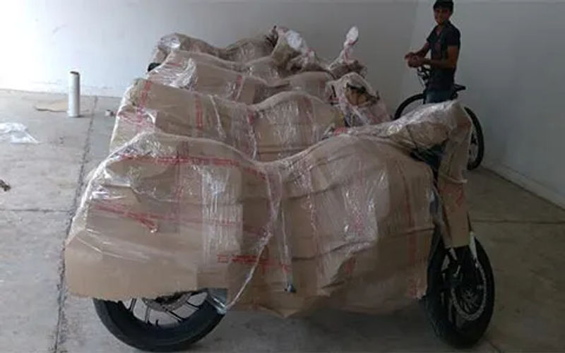Multishift bike transport service in Mumbai: bikes and scooters packed and crated for door-to-door transport
