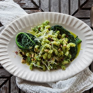 White bowl of Cavatappi Pasta with Kale Pesto