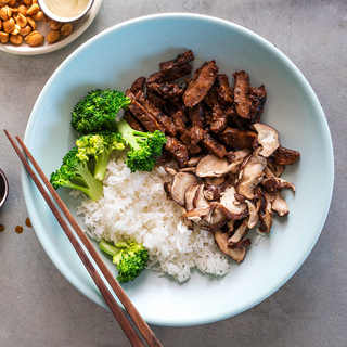 blue bowl with mongolian beef, broccoli and white rice