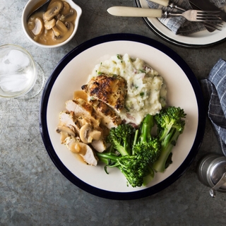 roasted sliced chicken breast with marsala mushroom sauce, mashed potatoes and broccoli