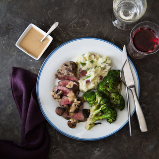 sliced steak diane with roasted mushrooms and broccoli and mashed scallion potatoes