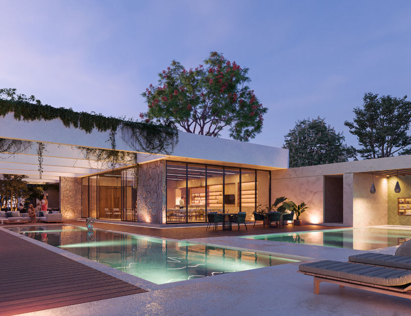 Casa Club y piscina de lujo en el desarrollo inmobiliario Gran Telchac Casa Club con piscina iluminada, arquitectura moderna y amenidades premium al atardecer en los lotes residenciales de Gran Telchac, Yucatán