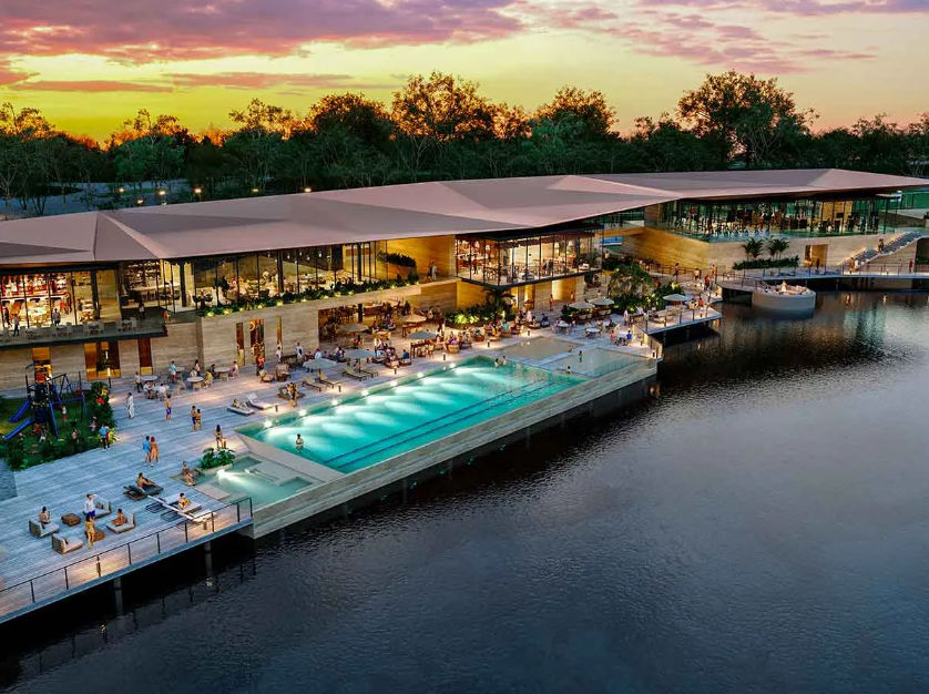 Casa Club Gran Provincia Yucatán: Albercas y Amenidades de Lujo | Itzimna Real Estate Espectacular Casa Club con alberca y terrazas de lujo frente al lago al atardecer en el desarrollo residencial Gran Provincia, Yucatán. Terrenos en venta por Itzimna Real Estate.