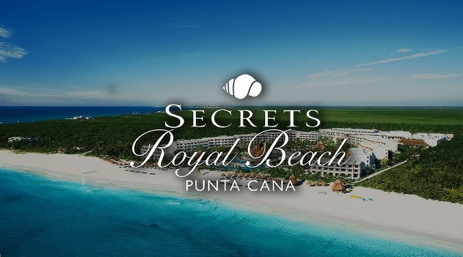 Aerial photograph of Secrets Royal Beach Punta Cana all-inclusive resort with its logo over the beach.