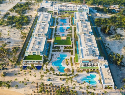 Aerial view of Serenade Punta Cana Beach and Spa Resort featuring swimming pools and a sandy beach