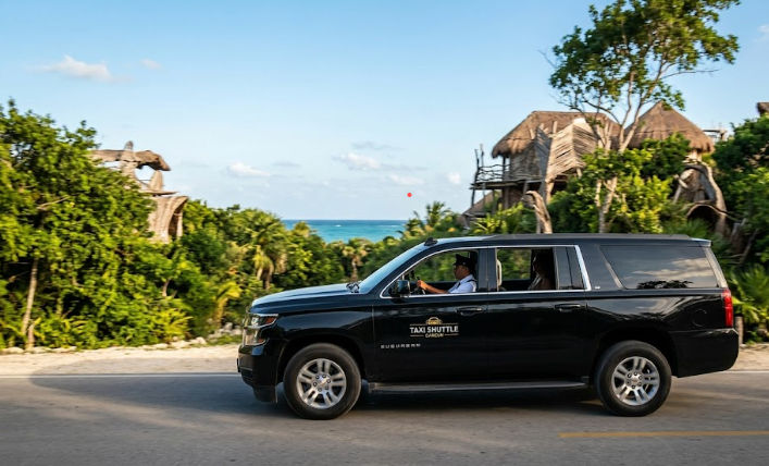 Private transportation service by Taxi Shuttle Cancun arriving at the entrance of the Azulik Adults Only eco-resort in Tulum