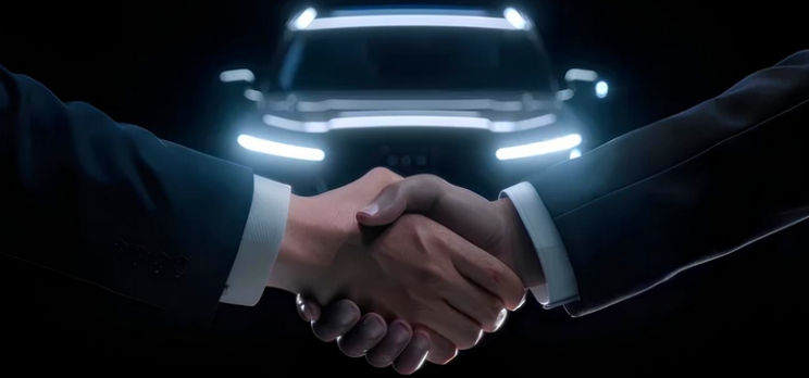 Two business executives shaking hands in front of a luxury SUV representing corporate transport