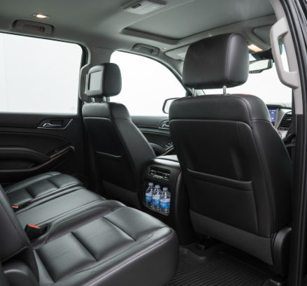 Private shuttle to Hard Rock Hotel Cancun featuring luxury Suburban interior with AC and bottled water