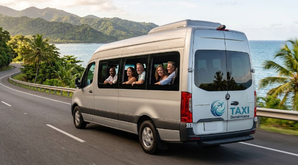 Taxi Dominicana passenger van on a scenic coastal road in the Dominican Republic for holiday transfers.