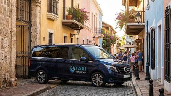 Dark blue Taxi Dominicana van parked on a cobblestone street in the Colonial Zone of Santo Domingo