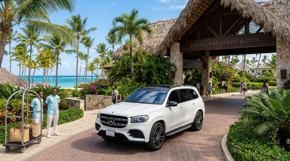 White luxury SUV arriving at a tropical resort in Punta Cana