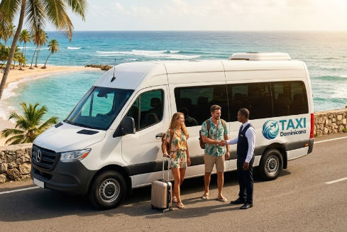 White Mercedes-Benz taxi van parked on a scenic Dominican Republic coastal road with a driver greeting a tourist couple, ocean and palm trees background