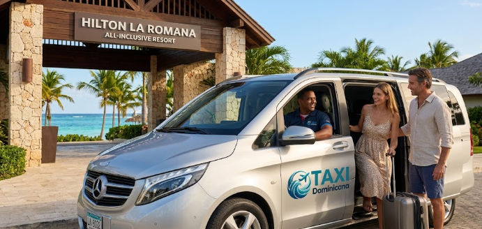 A happy couple with luggage disembarking from a Mercedes-Benz Taxi Dominicana van at the entrance of the Hilton La Romana All-Inclusive Resort