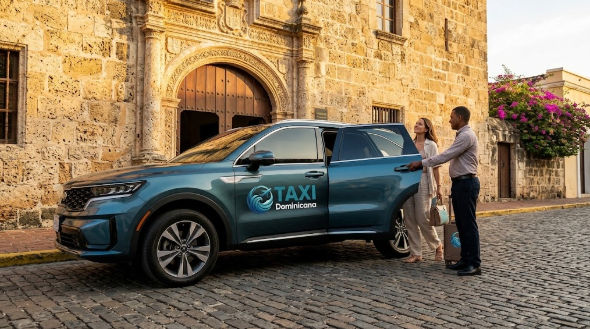 Driver opening the door of a blue Taxi Dominicana SUV for a passenger with luggage outside a historic colonial building