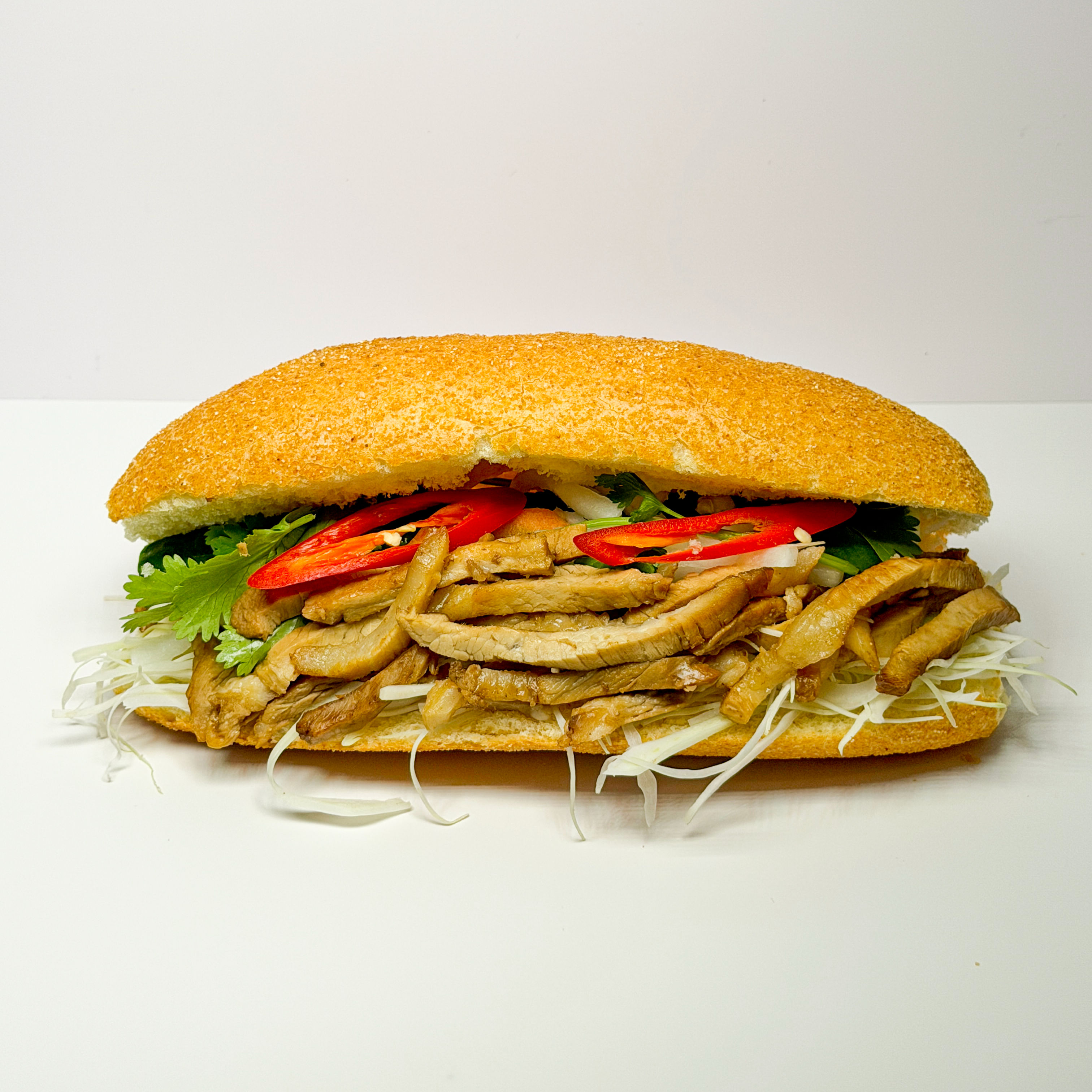 Authentic Vietnamese Banh Mi sandwich with fresh herbs and fillings in The Hague.