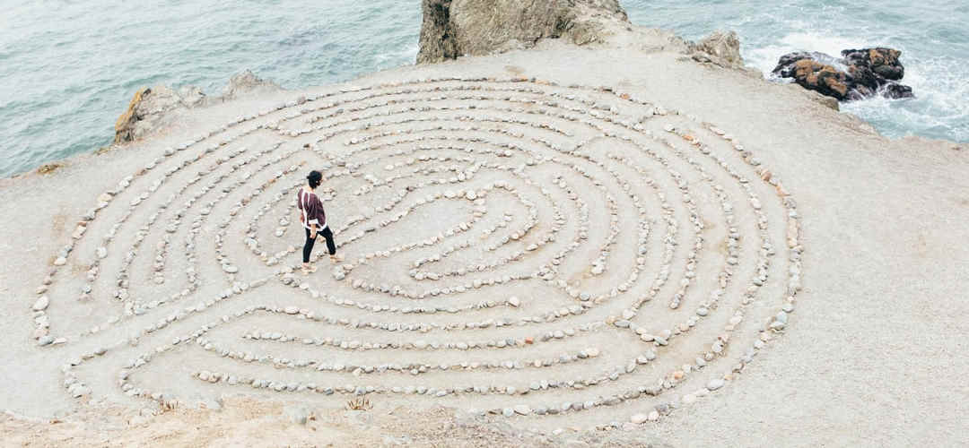 Woman walks in circular maze, an iterative process.